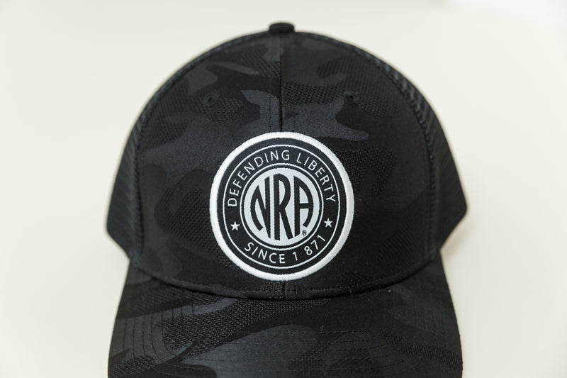 NRA® Dark Camo Trucker Circle Patch Cap